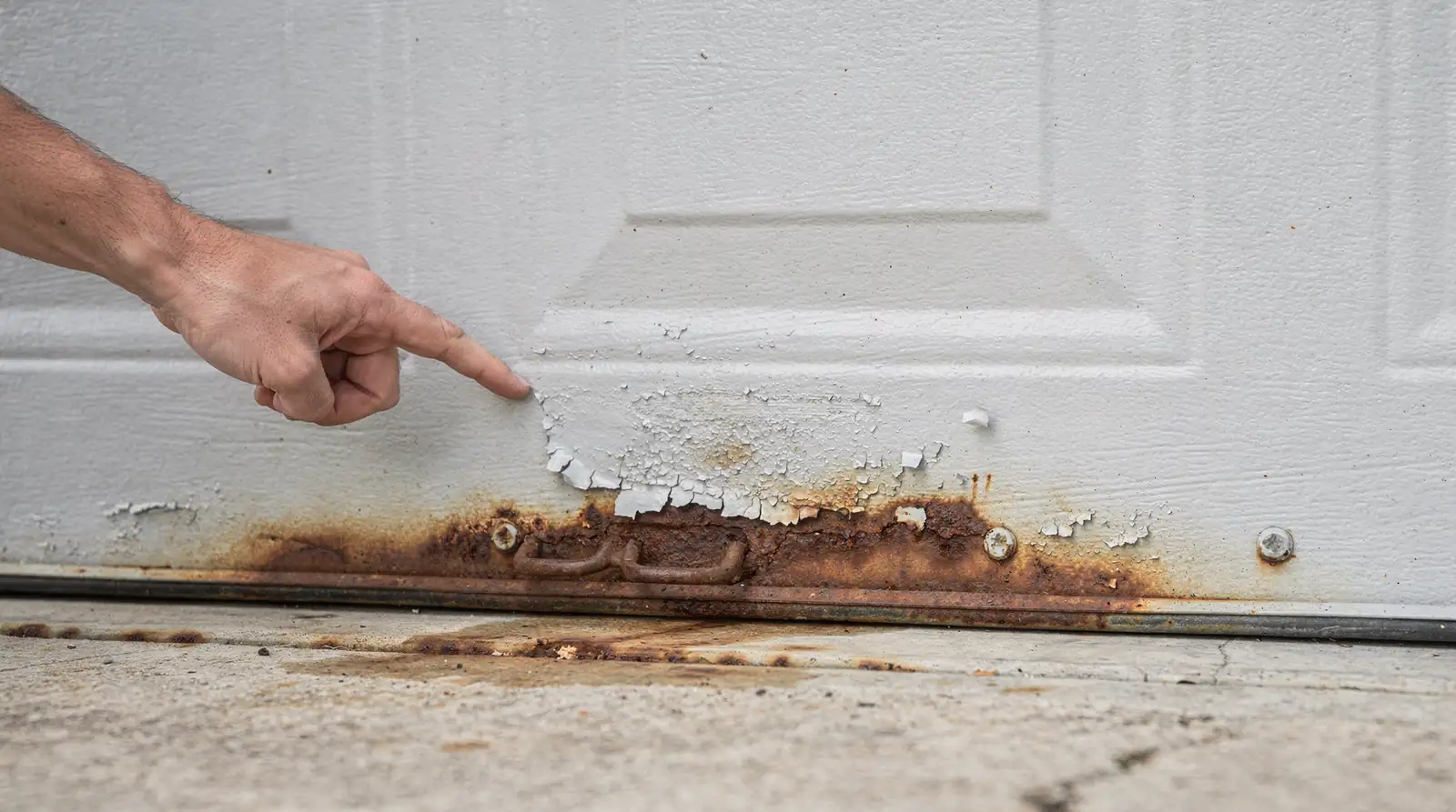 White, chalky buildup on metal parts is a common indicator of salt exposure.; Grinding, squealing